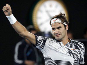 Roger Federer celebrates after defeating compatriot Stan Wawrinka 